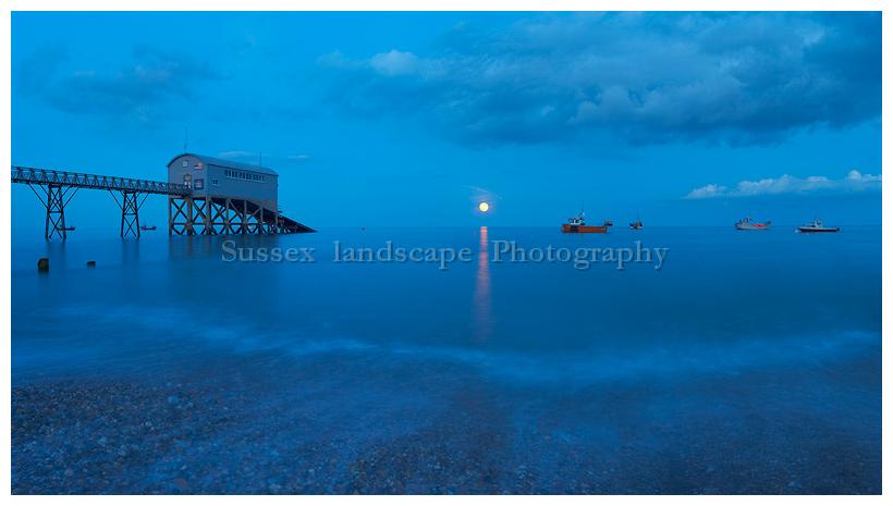 slides/Selsey Bill Moon Rise.jpg full moon,rising,selsey bill, west sussex,coast,water,boats, royal national life boat institution,colour blue Selsey Bill Moon Rise